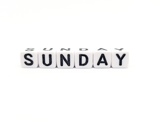 sunday word built with white cubes and black letters on white background