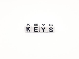keys word built with white cubes and black letters on white background