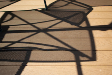 Porch Shadows of Table and Chairs