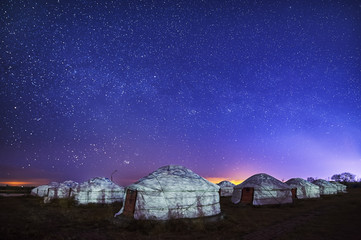 The Mongolian yurts and starry sky in night.