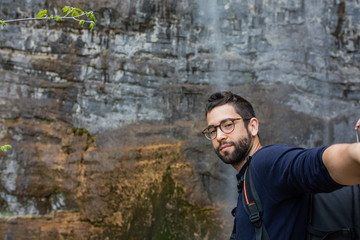 young man looking aside in the mountain