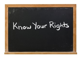 Obraz premium Know your rights written in white chalk on a black chalkboard isolated on white