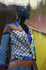 Fancy clothing on mannequins in window