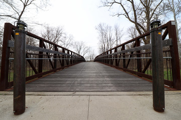 Utica, Michigan/ United States - April 17 2019: A bridge in the Clinton River Heritage Park.