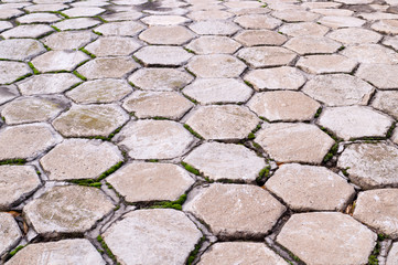 hexagon shaped tile paved sidewalk with perspective view. background, urban.