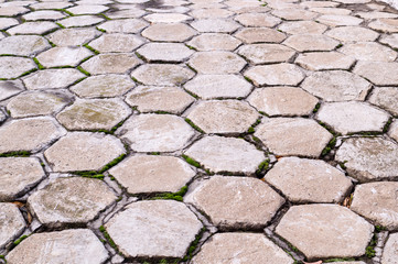 hexagon shaped tile paved sidewalk with perspective view. background, urban.