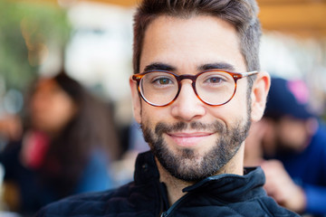 young man smiling in the city