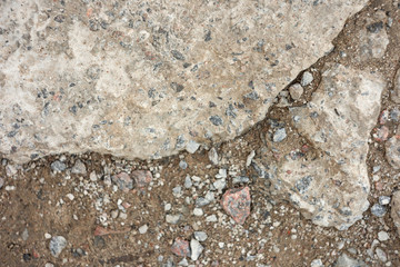 Old broken stone road with ground