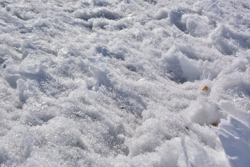 Spring Siberian city park in snowdrifts