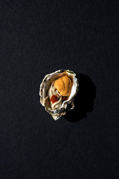 Single kumamoto oyster with uni and hot sauce