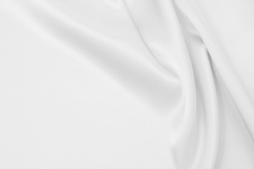 Fototapeta premium The texture of the satin fabric of white color for the background 