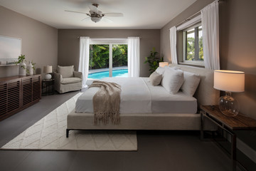 Florida home bed room overlooking Pool. 