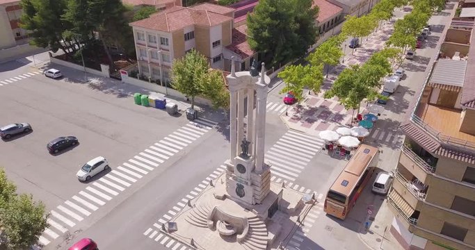 rotating aerial image of the city of Requena with monument of Harvest