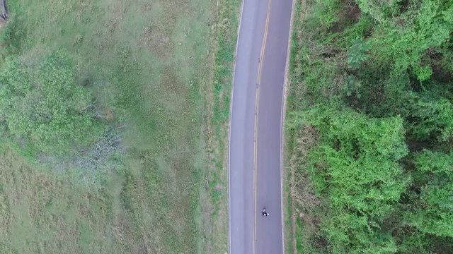 aerial image of freeway hill with skater doing slide tricks