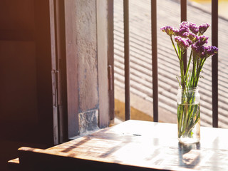 Lavender flower in glass vase near window