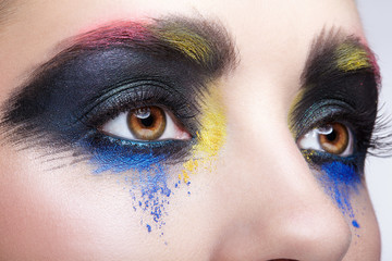 Obraz premium Female eye with unusual artistic painting makeup