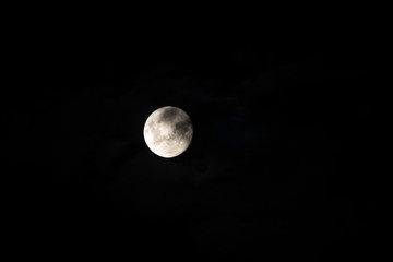 Naklejka na ściany i meble Close up of full moon in cloud