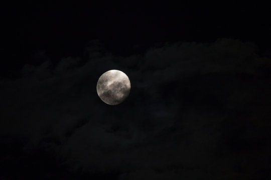 Close up of full moon in cloud