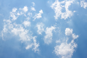 Blue sky background with tiny clouds