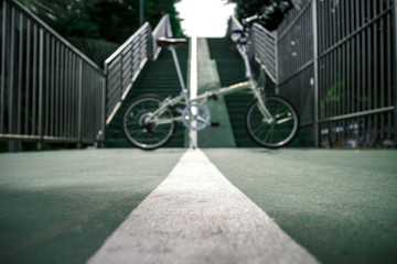 abstract blur and defocused of bicycle and sky green lane as park connector for background