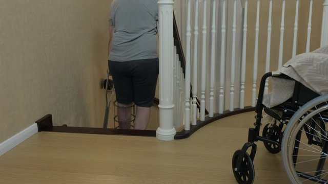 Climbing the stairs on crutches with a broken leg in the Ilizarov's external fixator