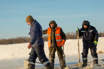 Naklejka premium Workers in overalls at the construction site