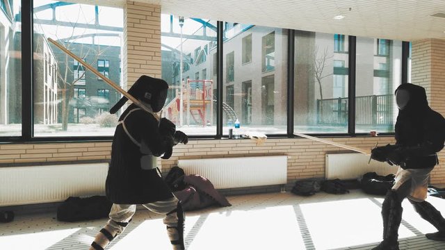 Swordsman fighting. Kendo practice. Duel sword combat training