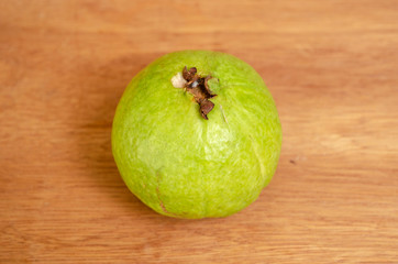 Top Of Ripe Round Guava On Board Surface