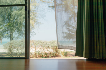 Fototapeta na wymiar Peaceful scene of the house with white transparent curtain.
