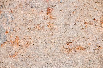 cracked old pink cement cement wall, stone texture background