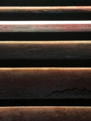 beautiful dynamic vertical lighting orange color background with cracking detail on cement texture, shiny brown vertical decoration background in pop retro style  use for night club, party