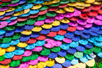 Fototapeta na wymiar Pattern made of colorful rainbow sequins.