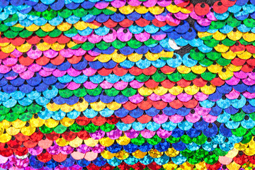 Pattern made of colorful rainbow sequins.