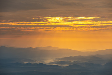 Beautiful mountain and morning sunrise over the sea of mist. Mon Sone View point , Doi Pha Hom Pok National Park in Chiang Mai,Thailand.