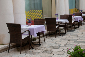 Fototapeta na wymiar summer city cafe, a number of tables for recreation