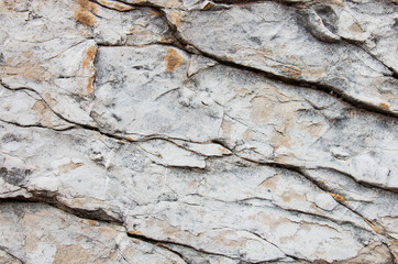 old stone marble wall in the cracks. light stone texture