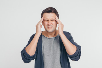 Fototapeta premium portrait of man thoughtful. Guy with hands on face isolated on white background
