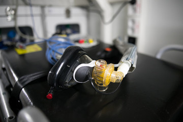 Doctor puts the oxygen mask on the patient before narcosis.