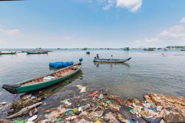 Fototapeta na wymiar The environmental pollution. The ecological problem. The shore near the fishing village. Vietnam, Phu Quoc