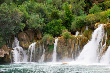 view of the waterfall and the blue lake in the Croatian National Park Krk