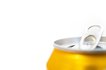 macro shot of opened golden can on white background