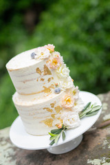 Cake with cream berrys and gold 