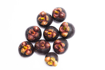 Group of mangosteen isolated on white background. Mangosteen is a queen of fruit in Thailand and asia fruit have a sweet. Fresh dark mangosteen background. Mangosteen is a popular fruit in Thailand.