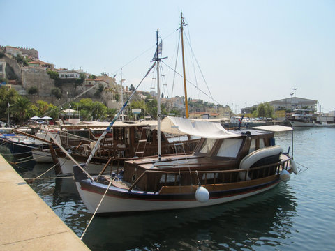 Greece, Kavala - Sertember 10, 2014. Small turists Greek boats moored to the shore