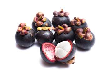 Mangosteen whole and half cut isolated on white background. Mangosteen is a queen of fruit in Thailand and asia fruit have a sweet. Mangosteen background. Mangosteen is a popular fruit in Thailand.