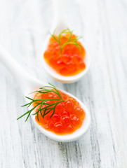 Spoon with delicious red caviar
