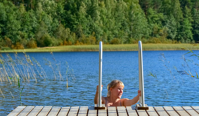 Woman swimming at lake