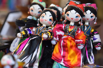 colorful traditional beautiful doll key chains hanging at the shop