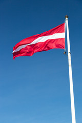 The Flag of Latvia waving in the wind