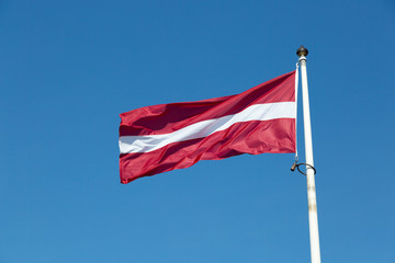 The Flag of Latvia waving in the wind